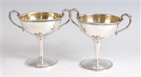 Lot 1127 - A pair of American sterling silver pedestal...