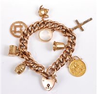 Lot 2606 - A 9ct curblink charm bracelet, set with...