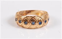 Lot 2516 - A seven stone gemset ring, the seven small...