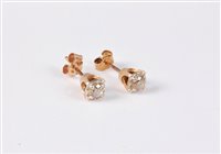 Lot 2635 - A pair of diamond earstuds, the round...