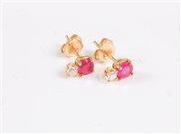 Lot 2620 - A pair of 18ct ruby and diamond earstuds, the...