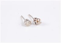 Lot 2678 - A pair of diamond earstuds, the round...