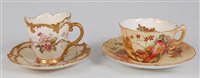 Lot 1065 - *A Royal Worcester reticulated cabinet cup and...