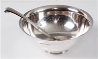 Lot 141 - A 1950s hammered silver circular footed soup...