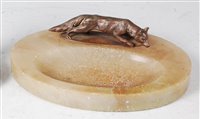 Lot 213 - An Art Deco onyx oval ashtray, mounted with a...