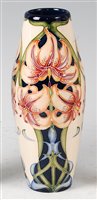 Lot 4 - A Moorcroft pottery vase in the Lily pattern...