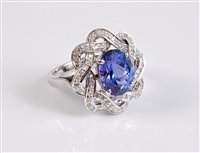 Lot 1169 - A 14ct tanzanite and diamond ring, the oval...