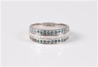 Lot 1204 - A blue and white diamond half hoop ring, the...