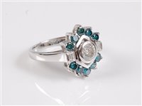 Lot 1163 - A 14ct blue and white diamond ring, the...