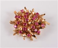 Lot 2612 - A 14ct ruby cluster clasp, the small textured...