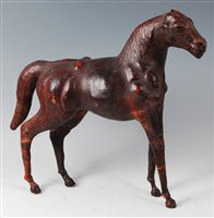 Lot 233 - An early 20th century tan leather clad model...