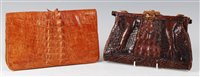 Lot 172 - An early 20th century crocodile skin clutch...