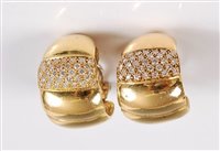 Lot 1212 - A pair of diamond earclips, the 15mm wide...