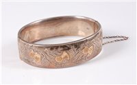 Lot 417 - A silver hinged bangle by Charles S Green & Co...