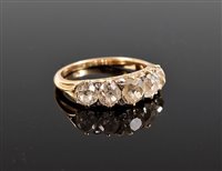 Lot 1209 - A five stone diamond ring, the five graduated...