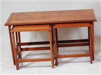 Lot 405 - A 1960s G-Plan teak nest of three occasional...