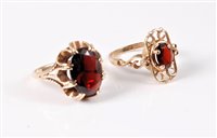 Lot 401 - Two 9ct garnet rings, the largest oval garnet...