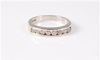 Lot 402 - A 9ct diamond half hoop ring, the total weight...