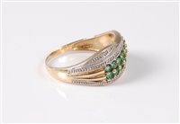 Lot 408 - A 9ct emerald and diamond ring, the two rows...
