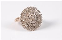 Lot 411 - A 9ct diamond cluster ring, the multi tiered...