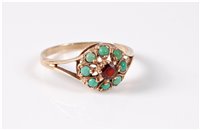 Lot 412 - A 9ct garnet and turquoise cluster ring, the...