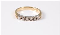 Lot 413 - An 18ct diamond ring, the six small round...