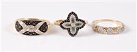Lot 414 - Three diamond rings: a 14ct black and white...