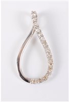 Lot 415 - A 9ct white gold and CZ pendant, the oval...
