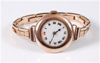 Lot 429 - A lady's 9ct wristwatch, with white dial, red...