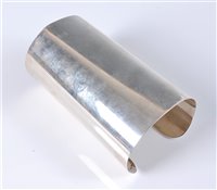 Lot 434 - A silver cuff bracelet, the deep cuff, 10.5cm...