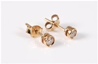 Lot 441 - A pair of 9ct diamond earstuds, the round...