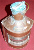 Lot 152 - A copper and brass ships lamp annotated 'Port'...