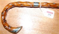 Lot 154 - A circa 1900 knotted wood walking cane with...