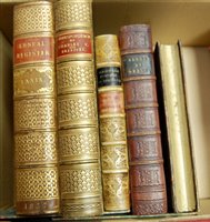 Lot 83 - A pair of bookends in the form of faux leather...