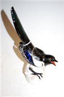 Lot 193 - A Russian Lomonosov porcelain bird ornament