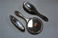 Lot 245 - A silver backed three piece dressing table set...
