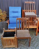 Lot 1168 - A contemporary slatted teak elbow chair;...