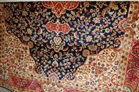 Lot 1218 - A modern Kashan carpet, having a blue ground,...