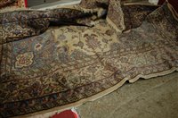 Lot 1216 - A Persian woollen cream ground carpet, of good...