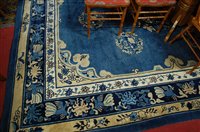 Lot 1214 - A Chinese Superwash blue ground carpet, having...