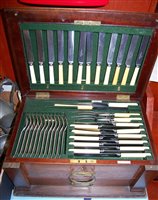 Lot 279 - A George V oak cased 12 place setting canteen...