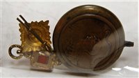 Lot 391 - A small copper flask, of circular form, relief...