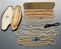 Lot 476 - A Lotus simulated pearl two-string choker,...