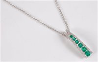 Lot 1216 - An 18ct emerald and diamond pendant, the...