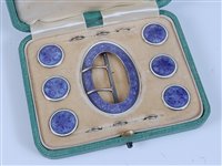 Lot 1150 - A cased set of silver and enamel buckle and...