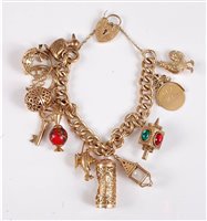 Lot 1177 - *A 9ct charm bracelet, the curblink charm...