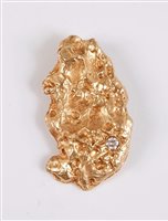 Lot 1207 - A 9ct diamond set pendant, the...