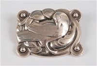 Lot 164 - *Georg Jensen (1866-1935) - a silver Dove...