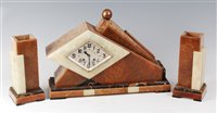 Lot 186 - A French Art Deco onyx and variegated marble...