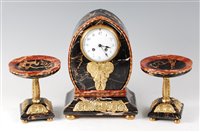 Lot 188 - A French Art Deco black variegated marble and...